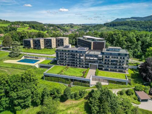 an aerial view of a building with a garden at Les Terrasses de Lavaux-2 Appartement de Luxe avec Vue Panoramique et Piscine" in Chexbres