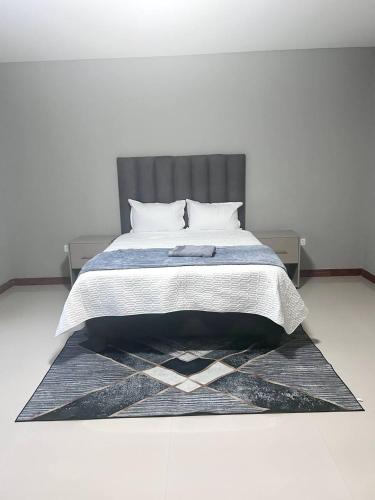 Cama o camas de una habitación en Reedbuck Apartments Kitwe