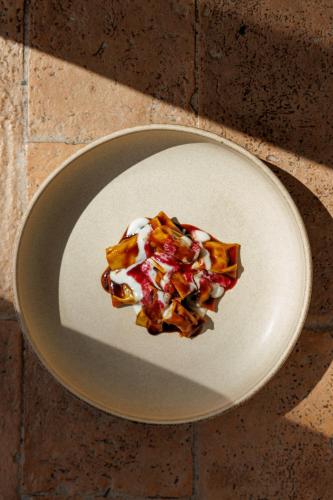 a piece of food on a plate on a table at Antichi Casali di Charme in Orvieto