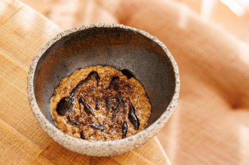 a cookie in a bowl on a table at Antichi Casali di Charme in Orvieto