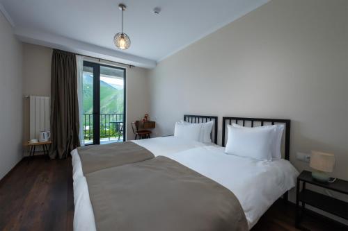 Cama o camas de una habitación en Residence Kazbegi