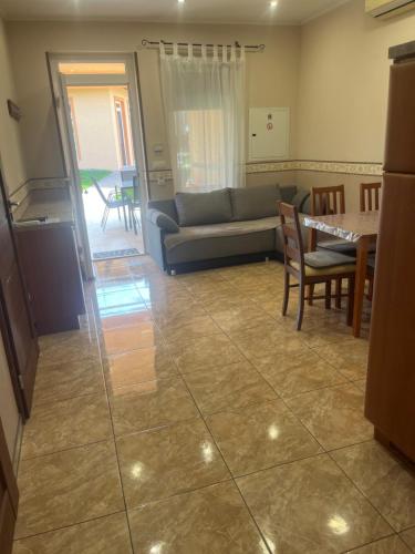 a living room with a couch and a table at Villa Gracia Podhájska in Podhájska