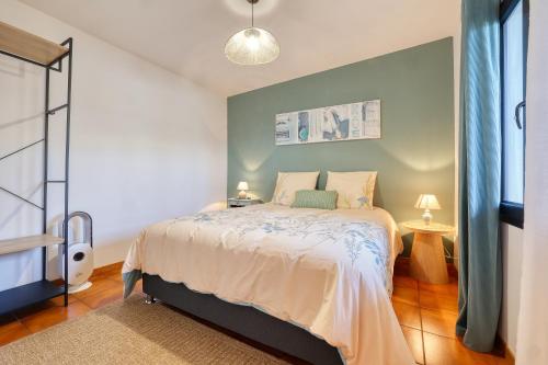 a bedroom with a bed and a window at La Kaz Mamie in Petite Île