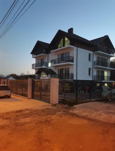 a house with a fence in front of it at Тихое место 