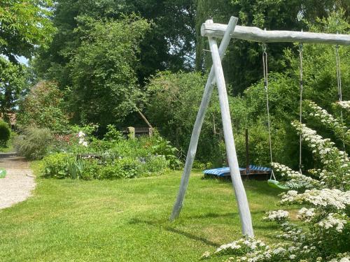 a swing in the middle of a garden at Landhaus am Schloss in Schnabelwaid