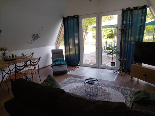 a living room with a couch and a table at Farm Ház in Fonyód