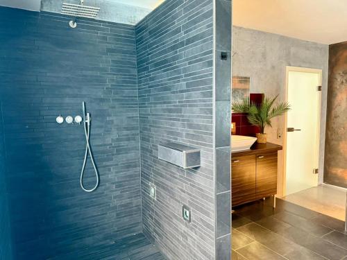 a bathroom with a shower and a sink at Apartment 1 in Pulheim