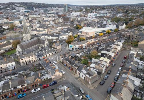 an aerial view of a city with buildings and cars at Charming City Retreat in Cork in Cork