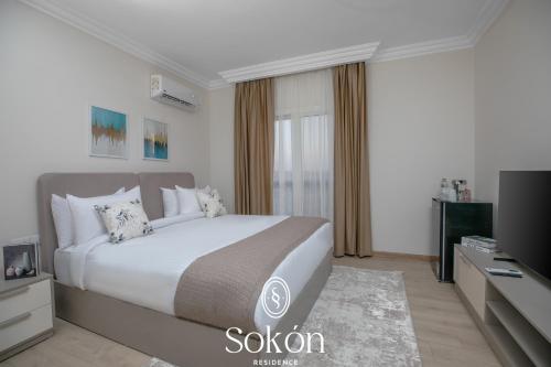 Кровать или кровати в номере Sokon Residence - New Cairo - El Rehab