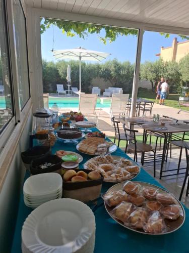 a table with a blue table cloth with food on it at B&B Signorino in Marsala