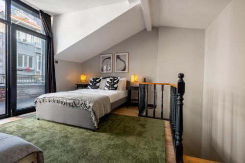 a bedroom with a bed and a large window at Fourlex Single Detached House - 2 Bathrooms - Central Location - Private Terrace in Istanbul