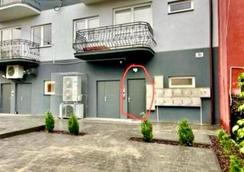 a building with a building with a staircase on it at Premium Exclusive Suite in Nowy Dwór Mazowiecki