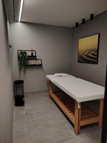 a room with a bed with a white mattress at La Dolce Vita in Maceió