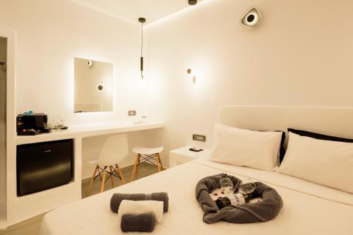 Postel nebo postele na pokoji v ubytování Tataki Family Hotel