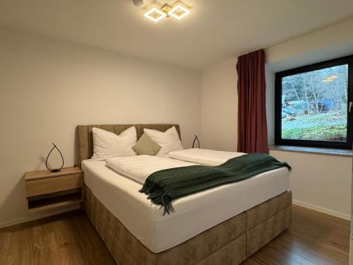 Postel nebo postele na pokoji v ubytování Hofgut FeWo & Spa
