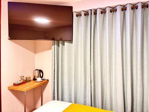 Postel nebo postele na pokoji v ubytování Hotel Litan Machu Picchu