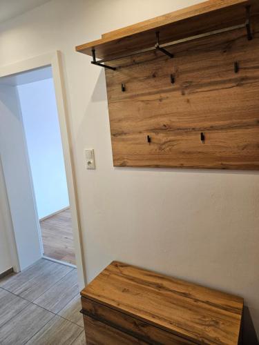 a room with a wooden wall with a wooden bench at Appartement Traunsteinblick in Weberstorf