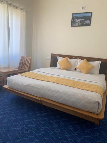 a large bed in a hotel room with at De Khar Guest House in Leh