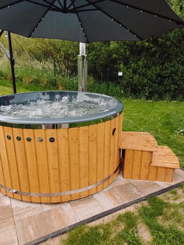 Gambar di galeri bagi Domek na Mazurach nad stawem z jacuzzi di Pasym