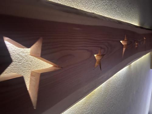 a painting of three stars on a wall at Willa Dolce Vita in Szczyrk