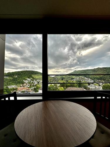 a table in front of a window with a view at Business Apartment Baden Central Station in Baden