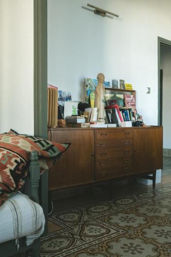 a bedroom with a dresser with books on it at Tunis Montfleury in Tunis