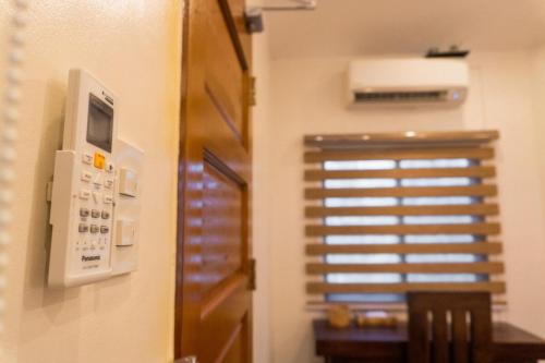 a room with a control panel and a window at Stela Garden Villas in Compostela
