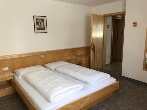 Ένα ή περισσότερα κρεβάτια σε δωμάτιο στο Residence Firn