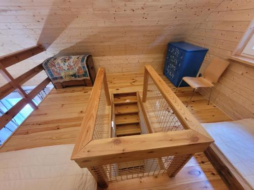 an overhead view of a bird cage in a wooden cabin at Bazylówka in Czyże