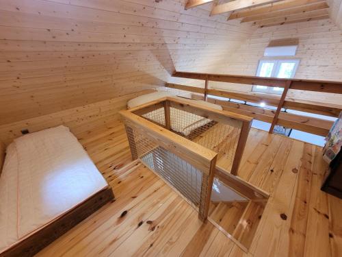 an overhead view of a wooden room with a wooden floor at Bazylówka in Czyże