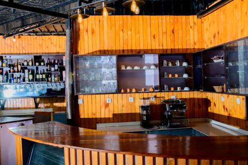 a bar with a table in the middle of a room at QUALITY INN HOTEL Kigali in Kigali