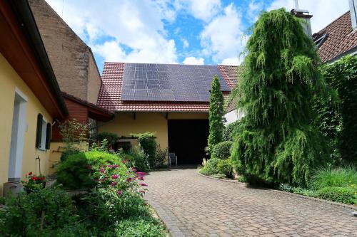 a house with a solar panel on the roof at Ferienhaus-Winzerhaus Sasbach in Sasbach am Kaiserstuhl
