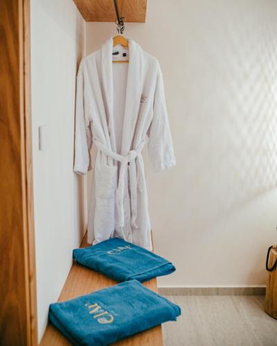 a robe hanging on a rack in a room at Elar Hotel in Sarandë