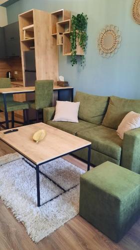 a living room with a couch and a coffee table at Tsaxkadzor, Kechi House ap 26 in Tsaghkadzor