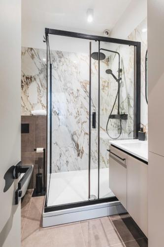 a bathroom with a shower and a sink at Sir John's Apartments in Rijeka