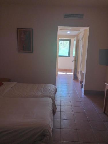 Ένα ή περισσότερα κρεβάτια σε δωμάτιο στο Sufetula Hotel