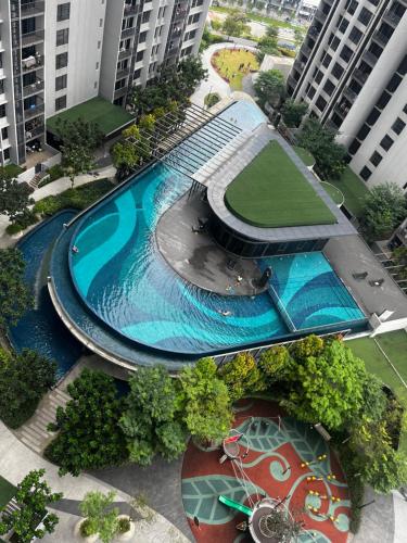 an overhead view of a swimming pool in a city at Geo Bukit Rimau Apartment in Shah Alam