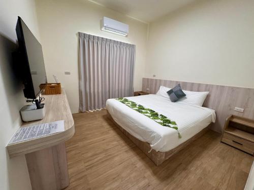 Ένα ή περισσότερα κρεβάτια σε δωμάτιο στο Mo Bi