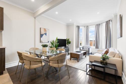 a living room with a table and a couch at The Parc Mile End ApartHotel in Montréal