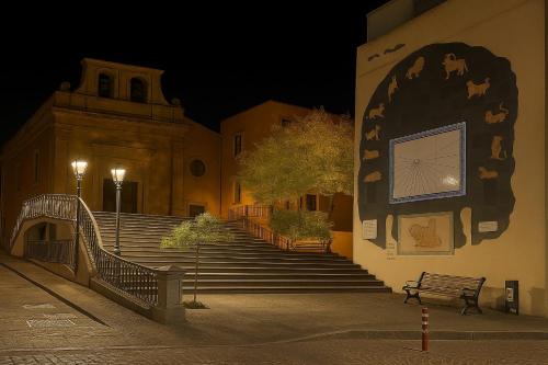 a set of stairs leading to a building at night at Adeles house in Misterbianco