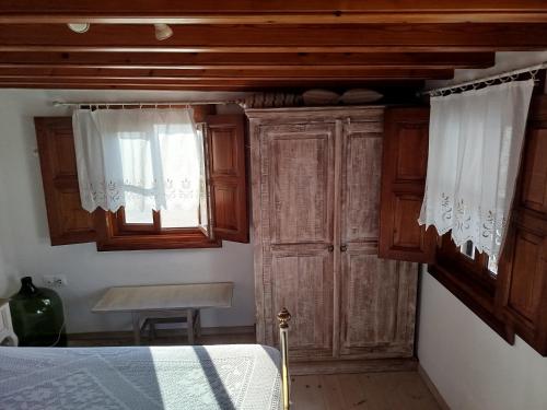 Postel nebo postele na pokoji v ubytování Manos House in Chora
