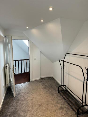 an attic room with a bed and a balcony at Nathanael Ferienwohnung mit Küche, WLAN & 4 Schlafzimmern in Werne an der Lippe
