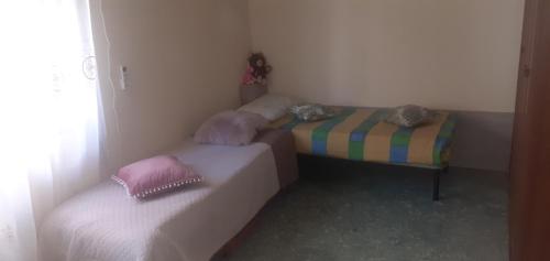 Postel nebo postele na pokoji v ubytování Casa dello Scoglio nel mare