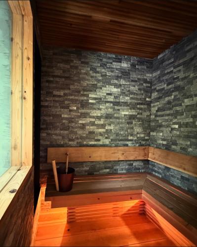 an empty sauna with a potted plant in a room at IGUANA Villa COSTA LATINA IWAI BEACH イグアナヴィラ in Wada