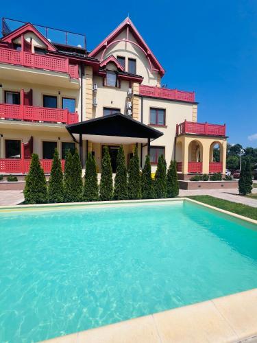 a house with a swimming pool in front of it at Diamond 2 in Palić