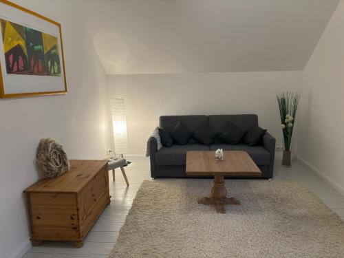 Et opholdsområde på Gemütliche Ferienwohnung mit eigenem Eingang am Speldorfer Wald