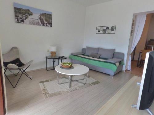 Ruang duduk di Apartments Green Garden