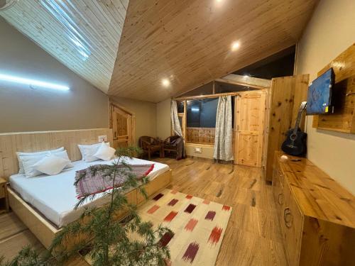 a bedroom with a large bed in a room at Rustic Roots Home Stay in Nagar