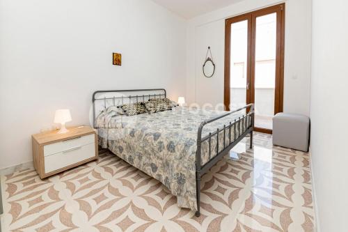 Postel nebo postele na pokoji v ubytování Il Bacio del Sole - San Foca