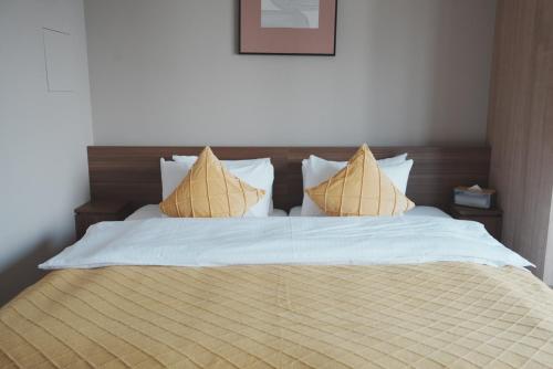 Postel nebo postele na pokoji v ubytování ICHIYU HOTEL ASAKUSA